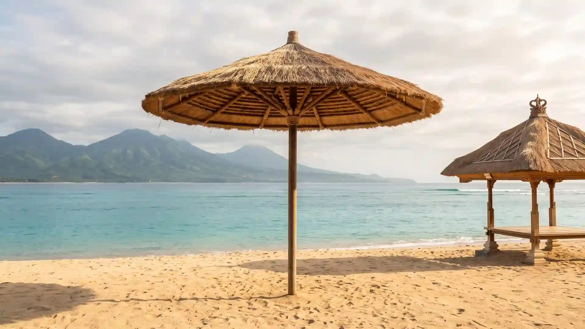 Beach with thatched umbrellas in Bali