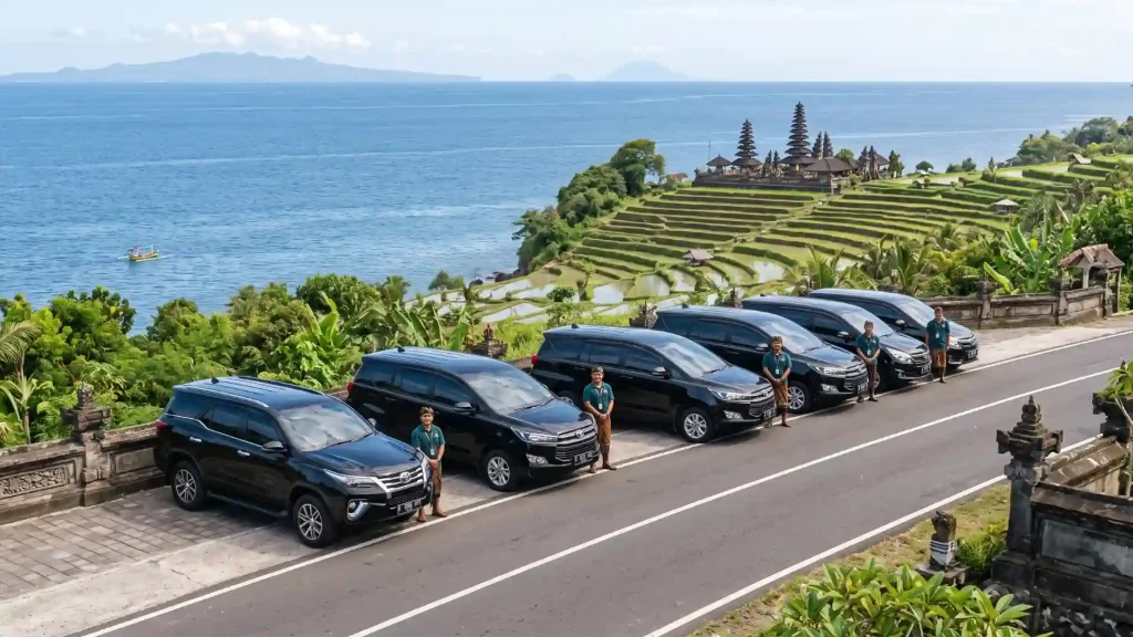 Row of private cars parked on a coastal road in Bali