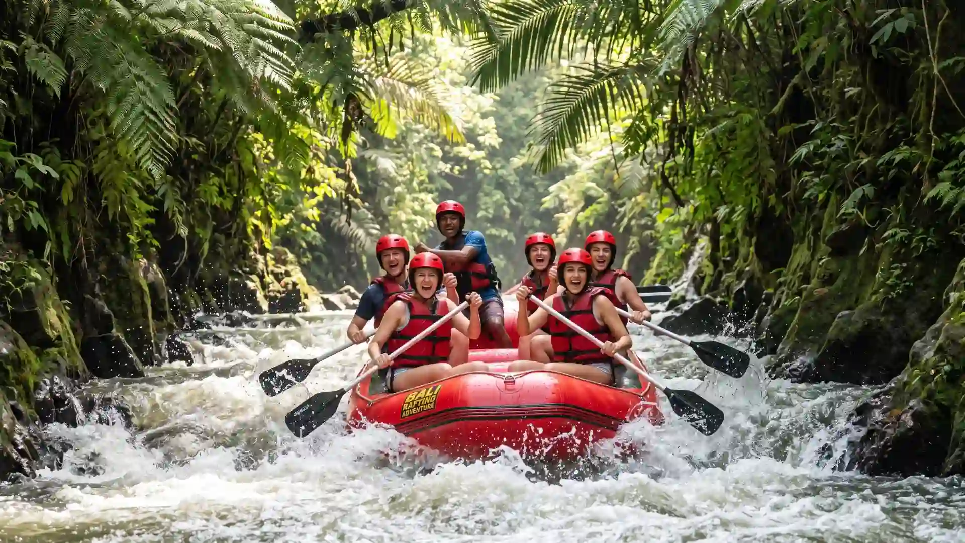 Rafting team paddling through white water in Ubud, Bali